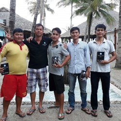 Picture of a group of people standing outside a dive centre. 