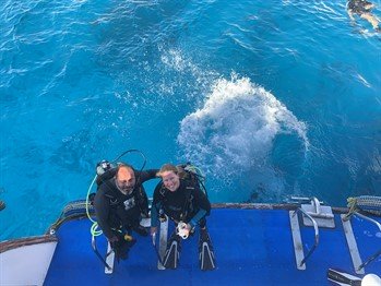 Reef-World's Chloe Harvey about to jump off the boat into the ocean to go diving in Egypt