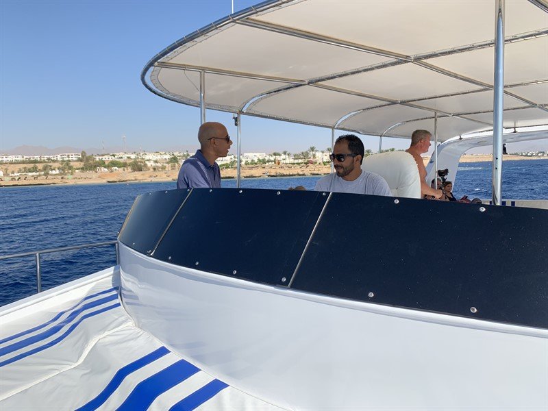 Picture of some of the Green Fins Egypt team on a boat. 