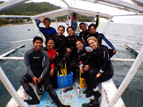 Picture of the Reef-World and Green Fins Philippines teams on a diving boat. 