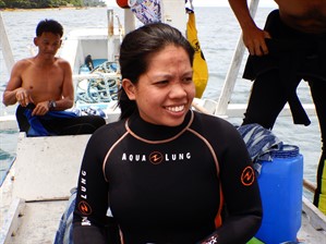 Picture of a member of the Green Fins Philippines team on a dive boat. 