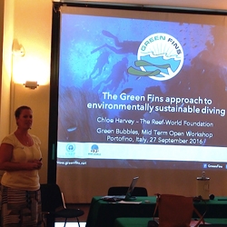 Picture of Chloe from Reef-World giving a presentation about the Green FIns approach to environmentally sustainable diving. 