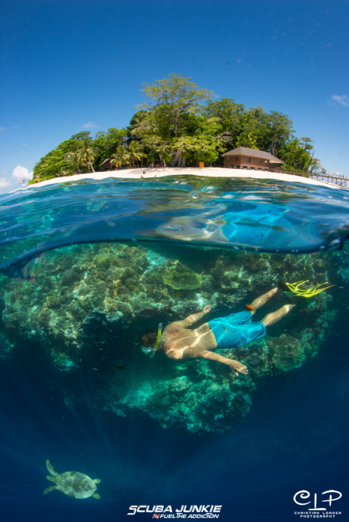 A snorkeller enjoying the underwater world at Pulau Sipadan with Scuba Junkie (Photo credit: Christian Loader)