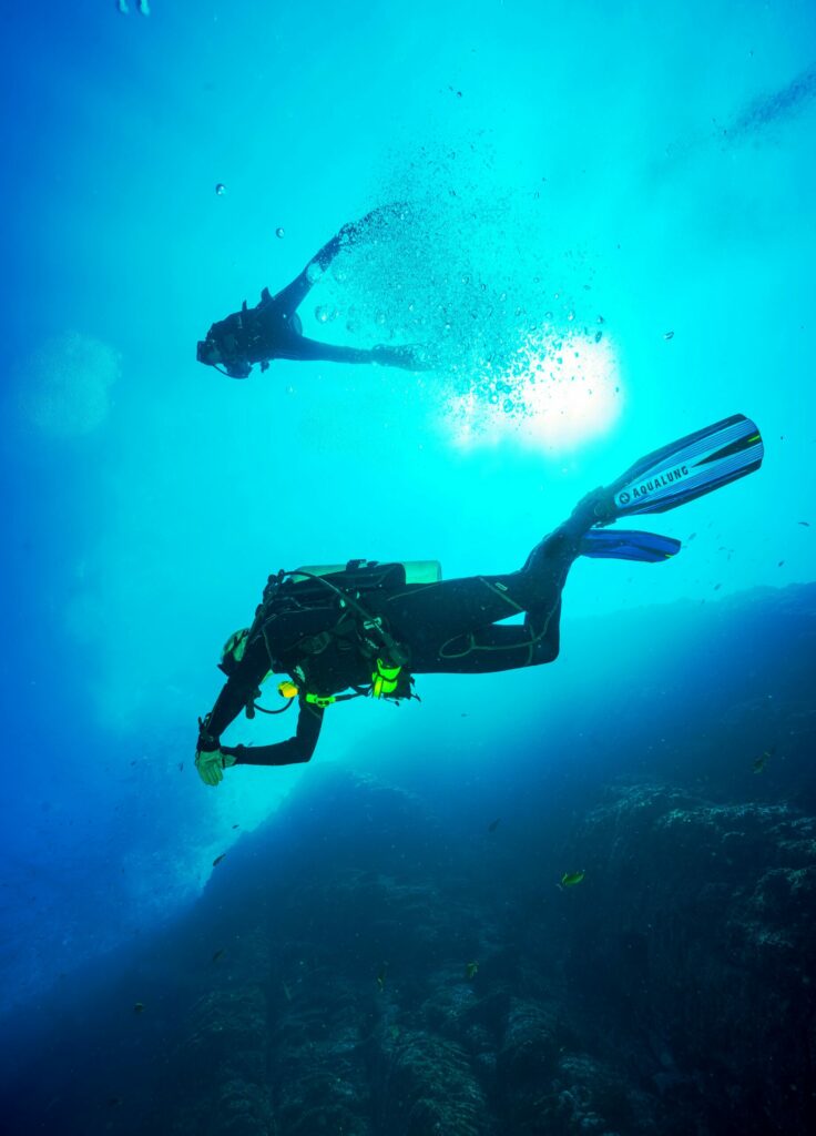 Photo of scuba diver swimming in the water column. Source: Unsplash