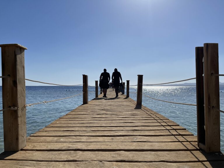 Ddivers walking down the pier in Egypt